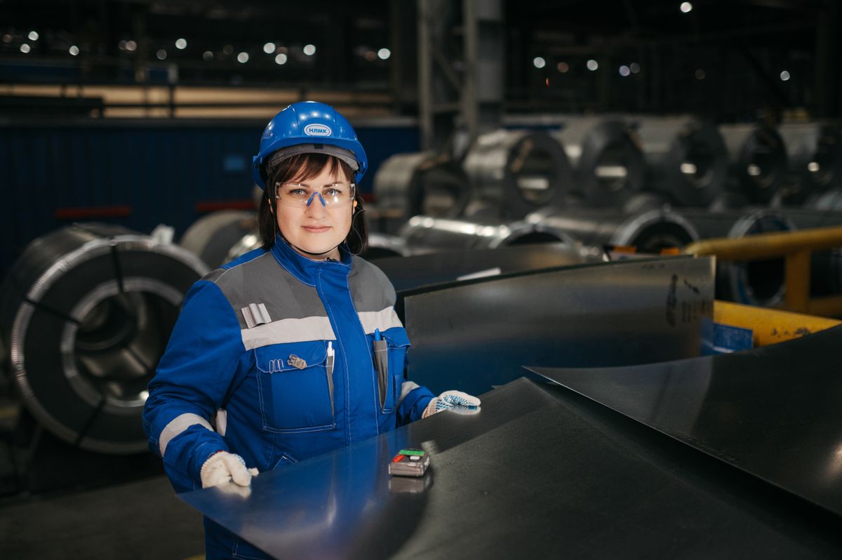 Inspector verifying material quality on a production floor