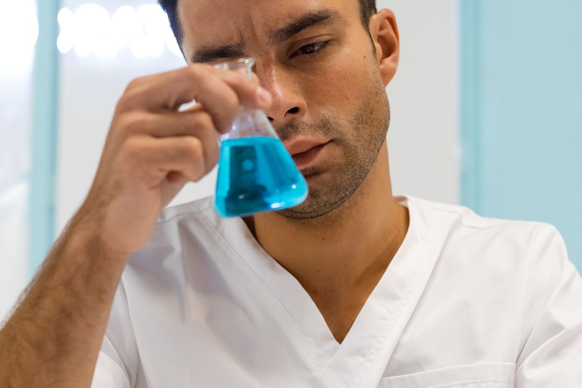 Laboratory technician evaluating a sample during product testing