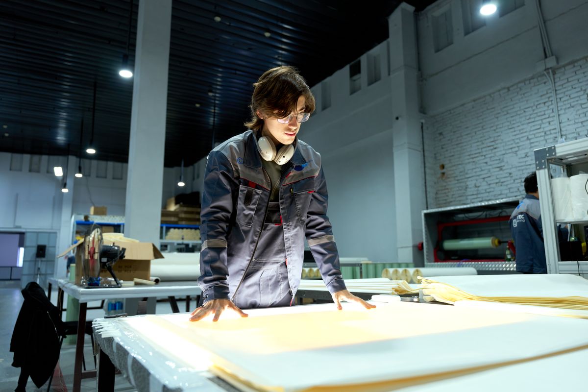 Engineer reviewing technical drawings and product design
